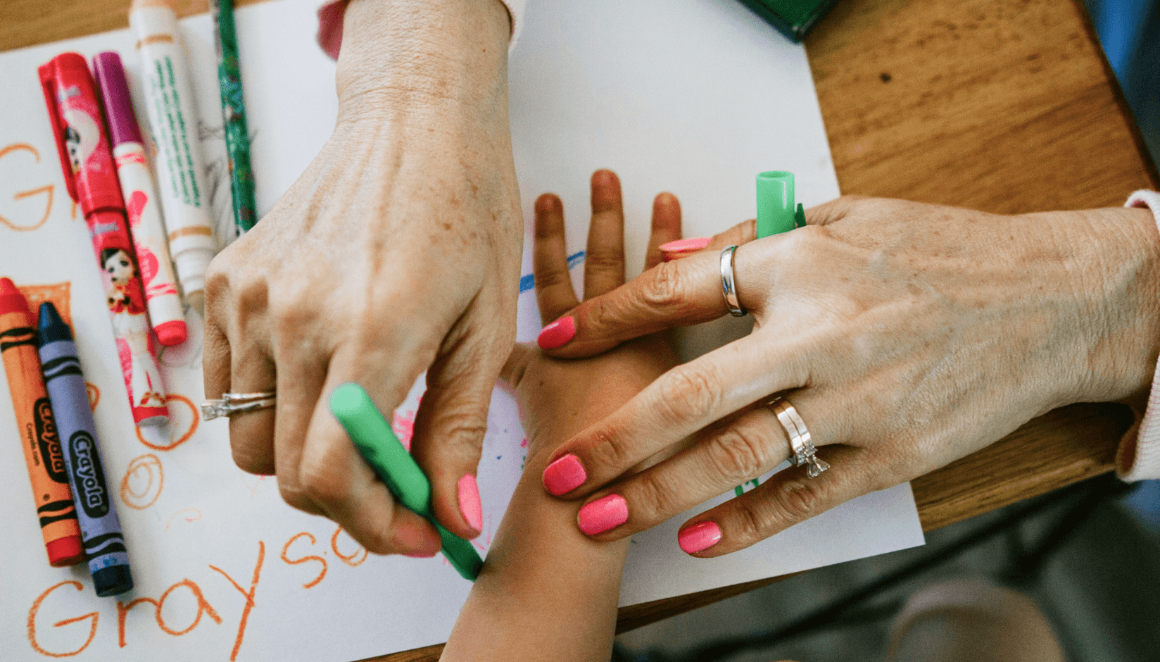 A boy with a teacher at a coworking space with daycare