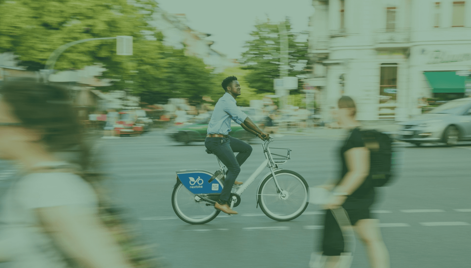 Coworking space member riding a bicycle to the office.