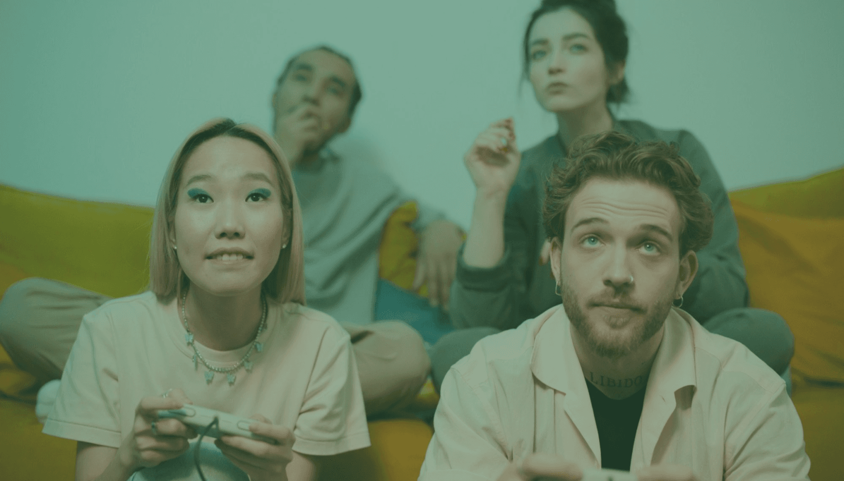 members playing video games at a coworking space