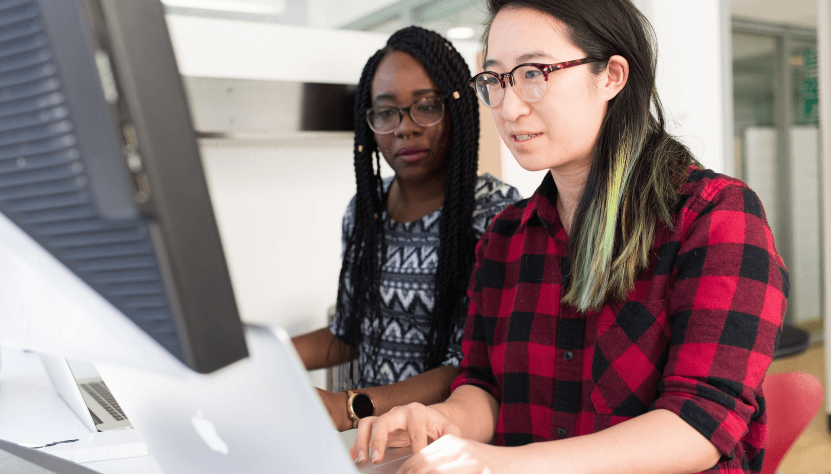 two women at the desk at a coworking space 