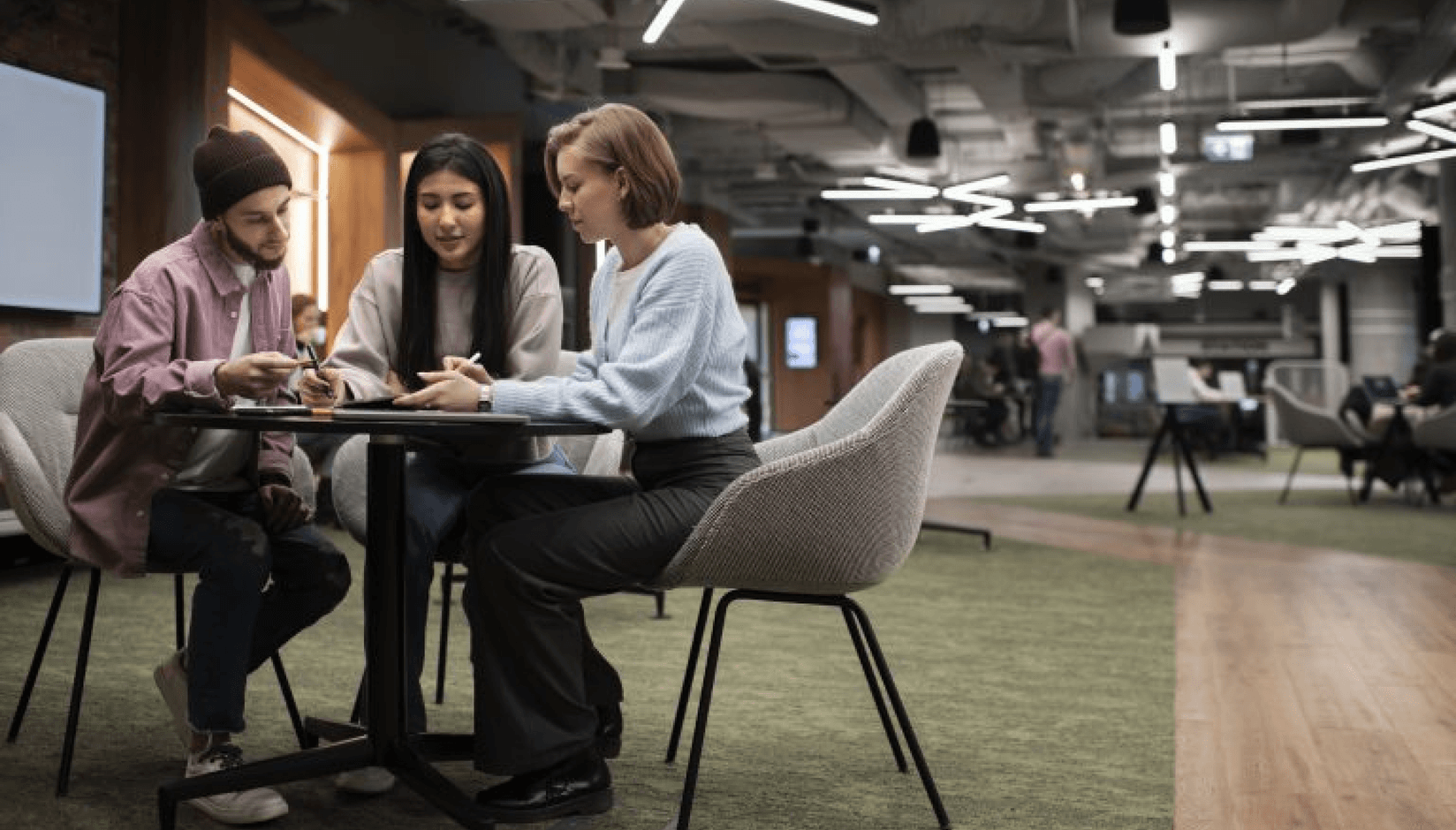 Coworking space managers discussing cutting maintenance costs 