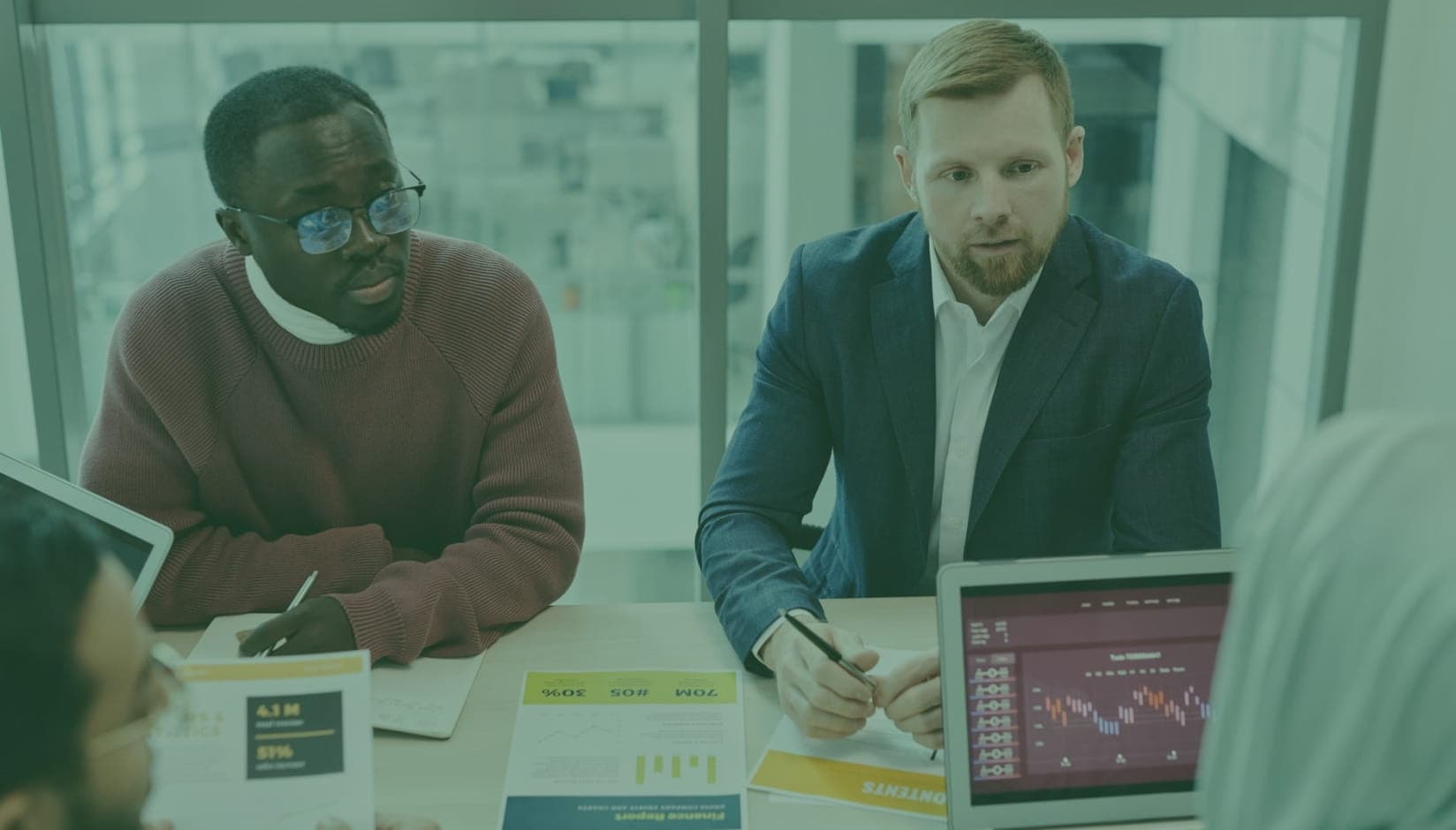 Coworking space managers analyzing workspace website