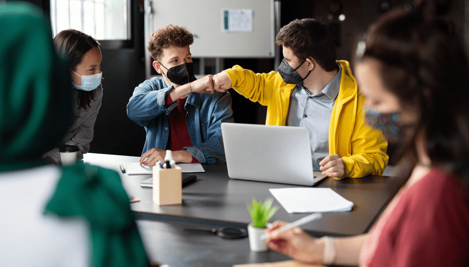 Digital nomads communicating at a coworking space