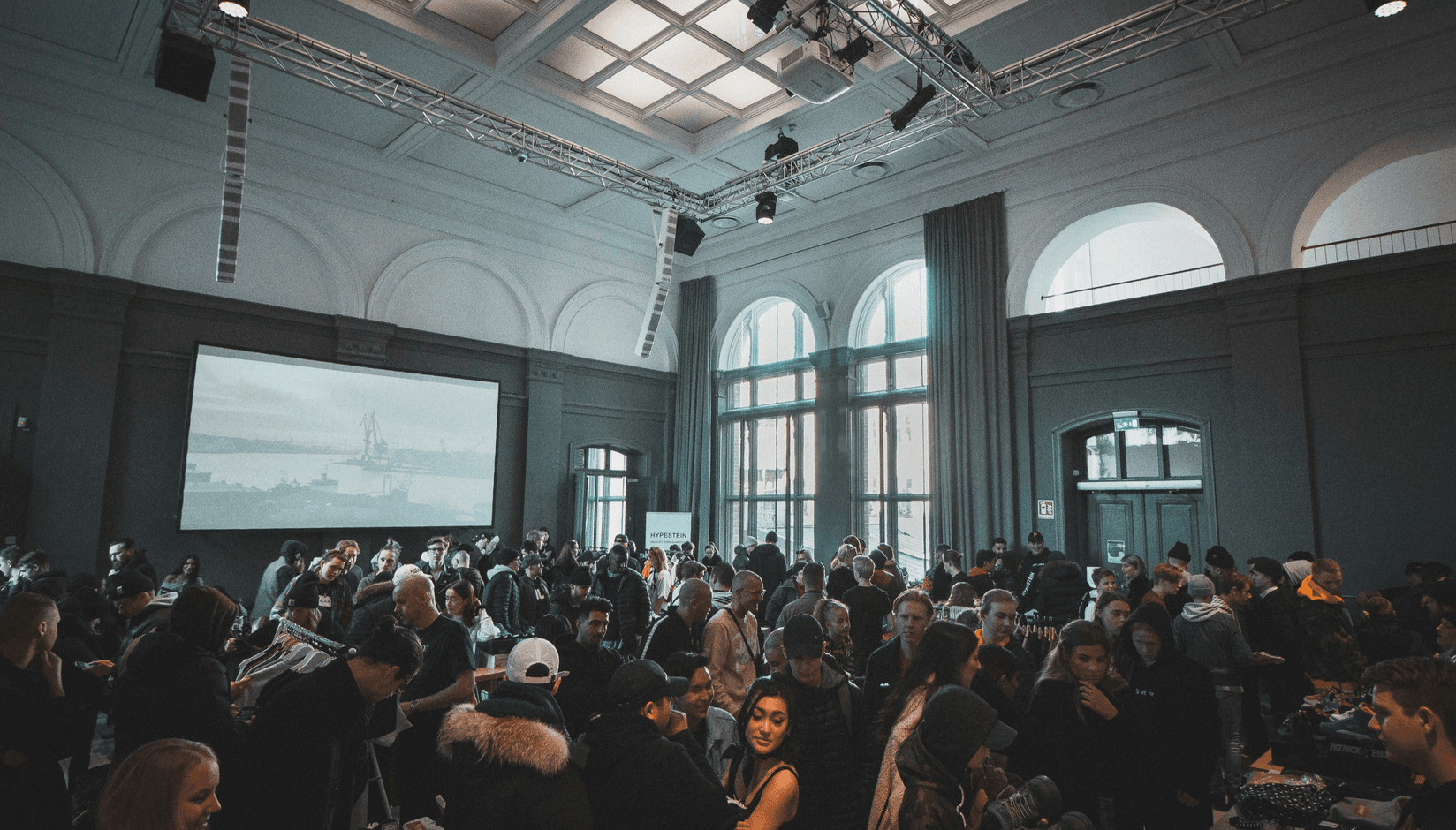 woman coworking space member in a round hat lying on a bamboo lounge