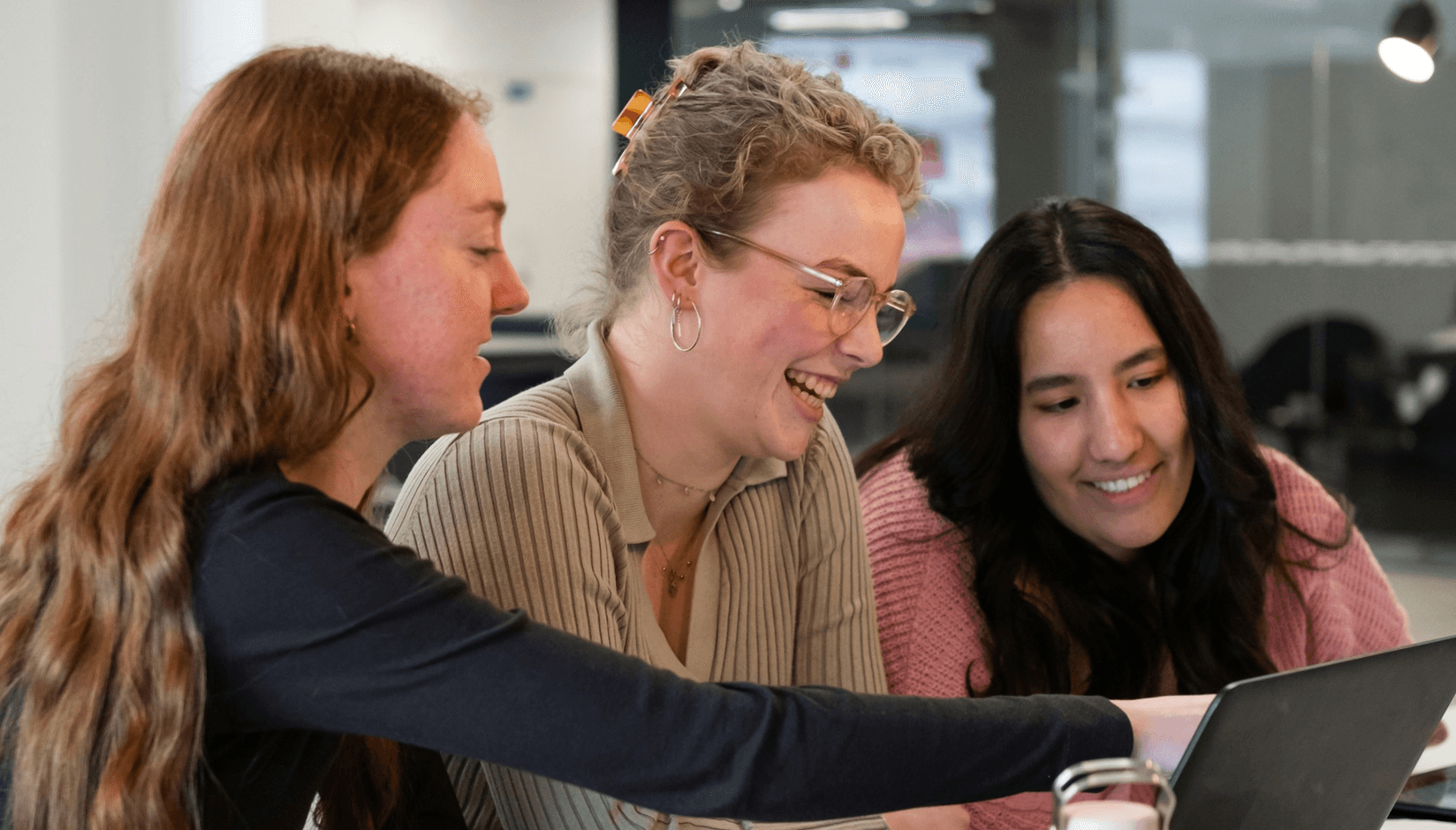 Smiling freelancers at a coworking space