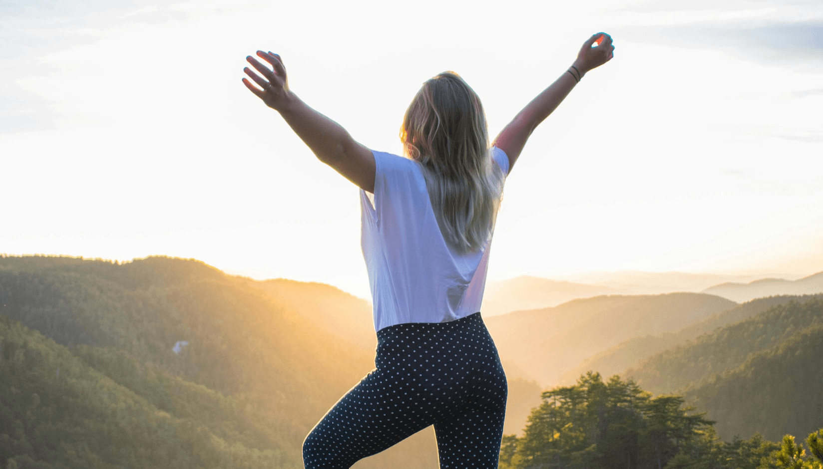 man coworking space member breathing fresh air in the mountains