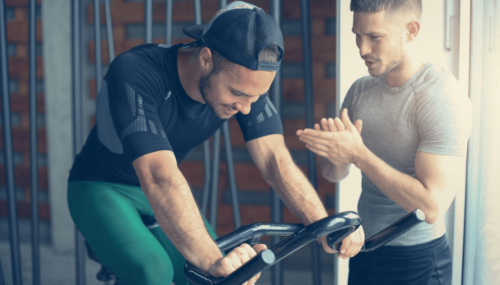Trainer with a client in a micro gym