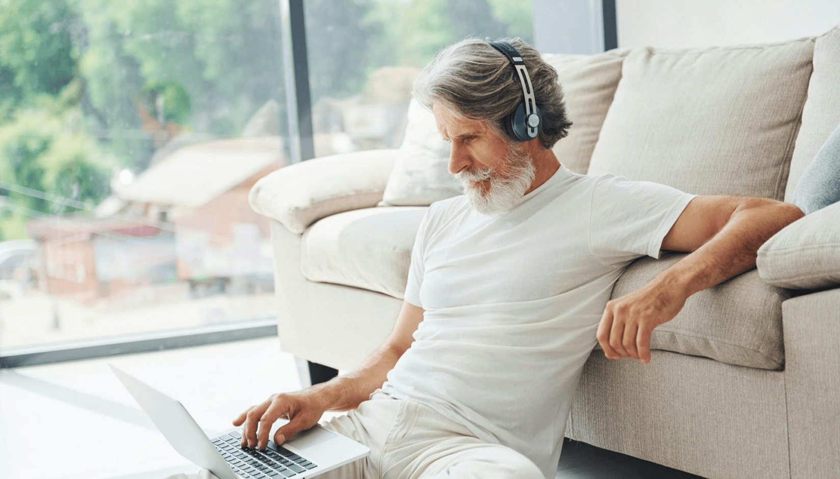 Member with a laptop at a co-living space